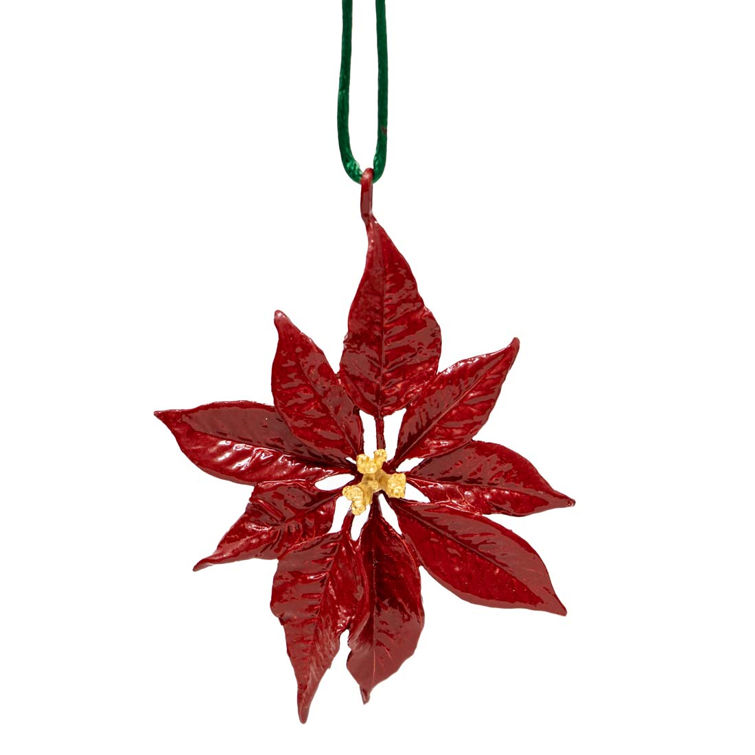 Red poinsettia flower ornament with a gold center on a white background