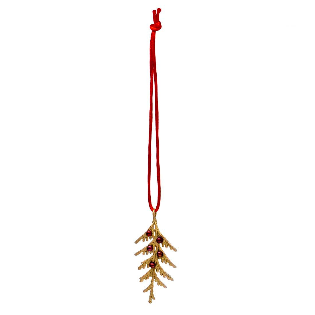 Decorative mistletoe ornament with red berries on a white background