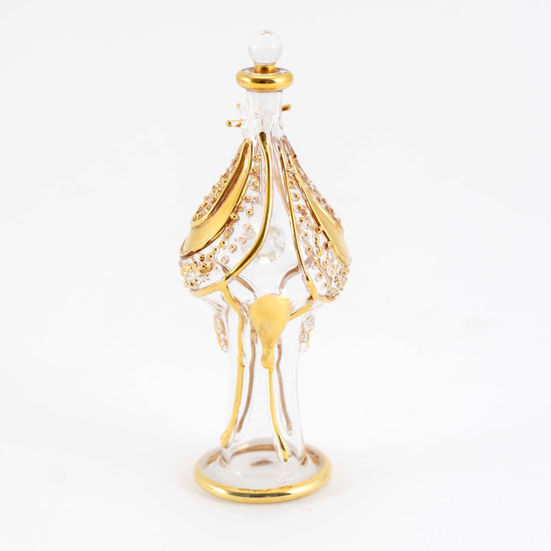 A gold camel-shaped glass perfume bottle with a clear glass stopper, featuring intricate patterns and designs.