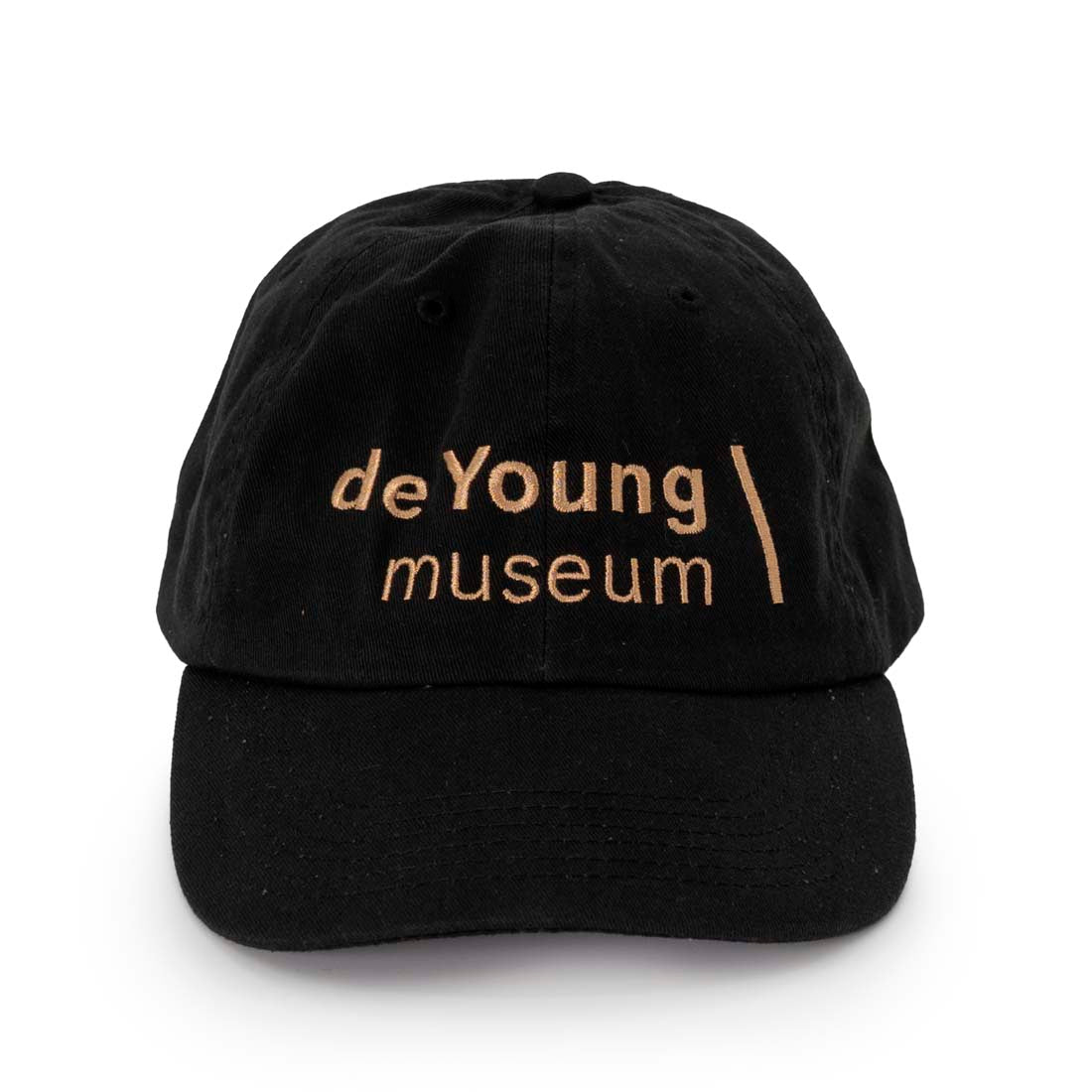 A black baseball cap with 'de Young museum' embroidered in gold stitching on the front.