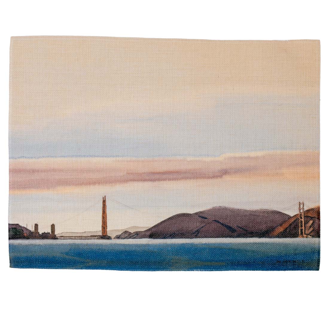 Woven blanket with a scenic landscape of a bridge and mountains.