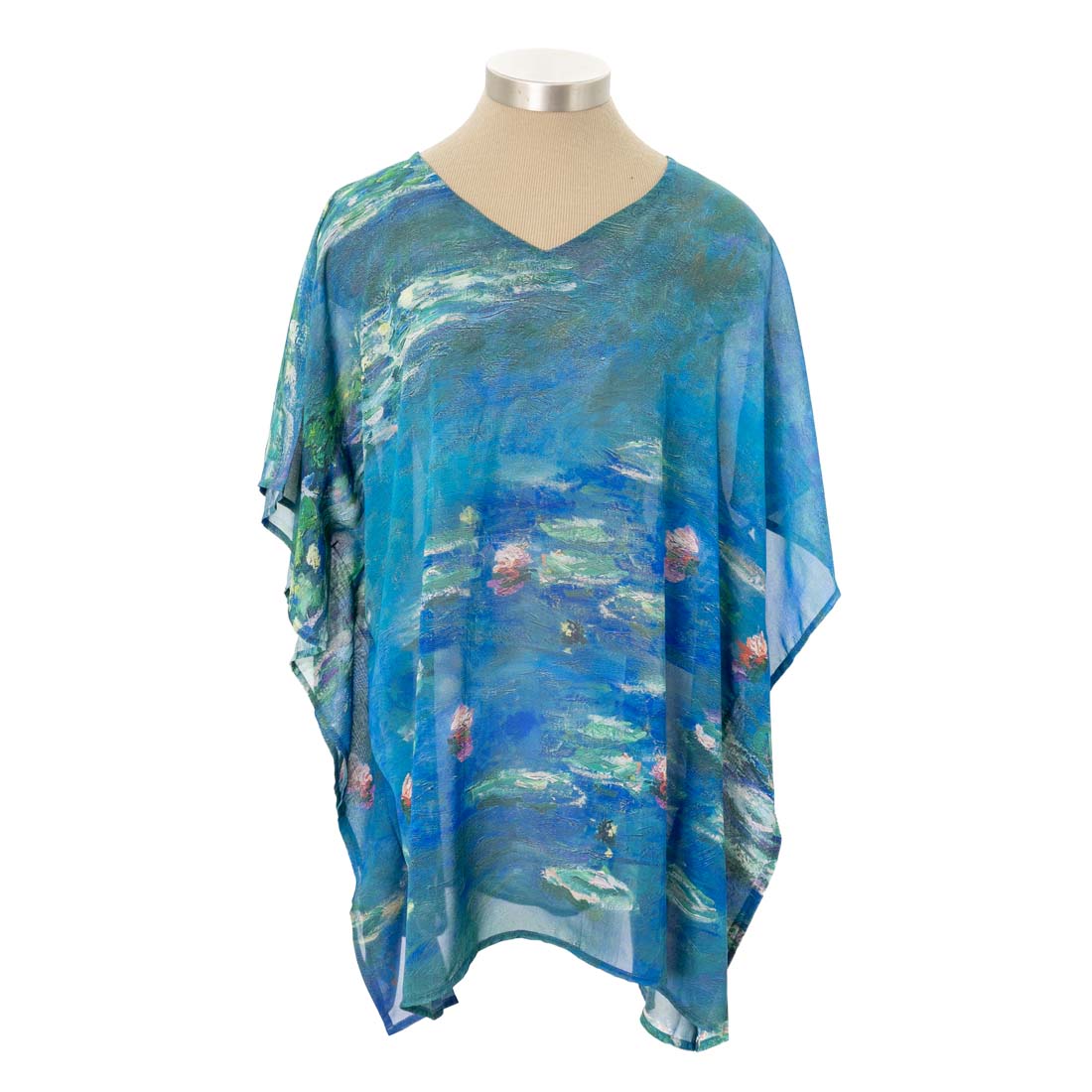 Mannequin wearing a blue and green patterned poncho on a white background
