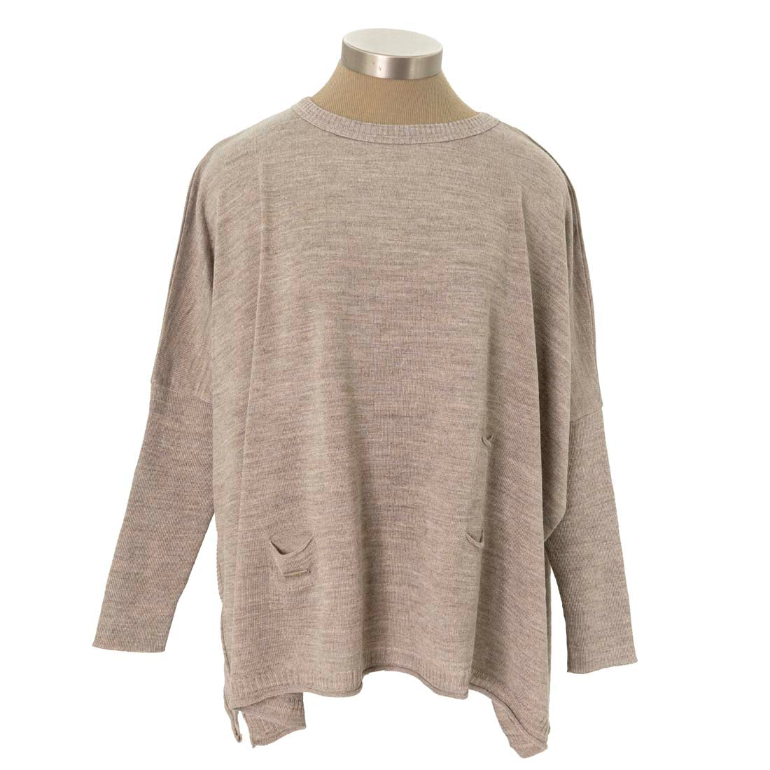 Beige sweater on a mannequin against a white background