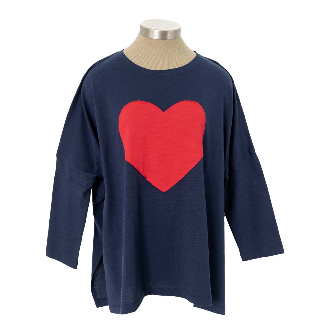 Navy blue sweater with a red heart on a mannequin against a white background