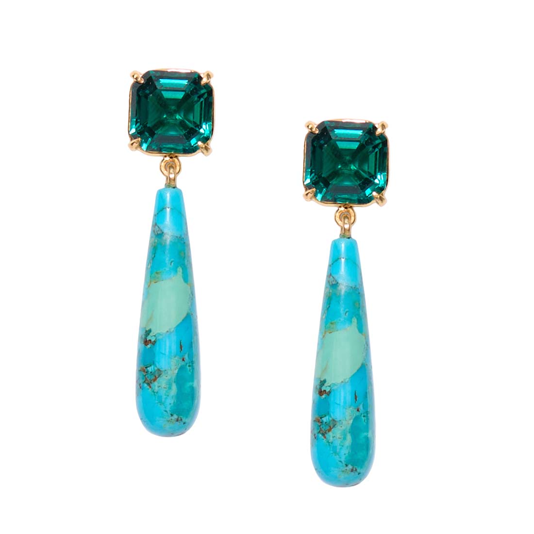 Pair of earrings with green square stones and blue teardrop-shaped drops on a white background
