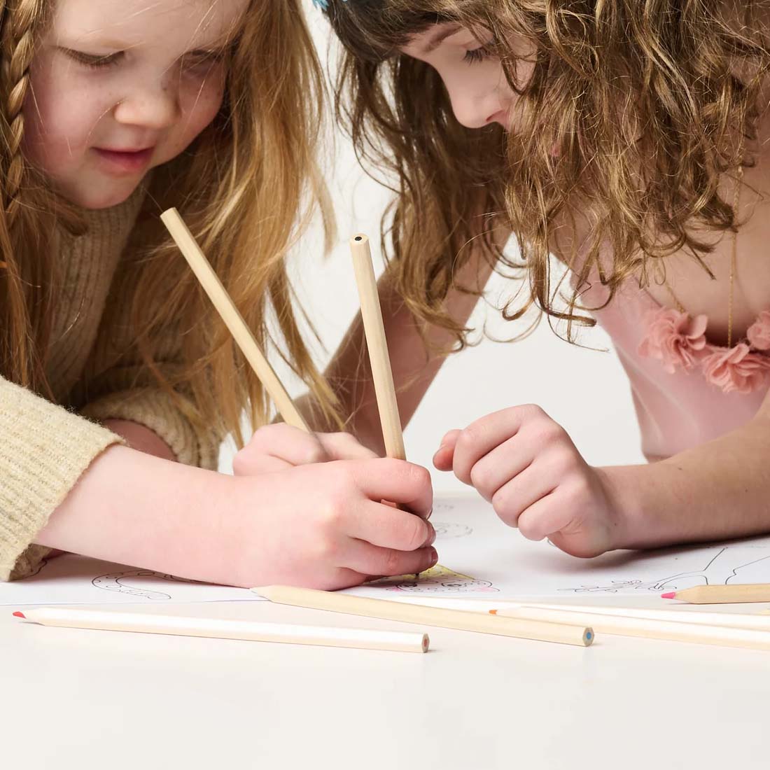 Set of colored pencils with a cylindrical packaging labeled 'else ware' on a white background