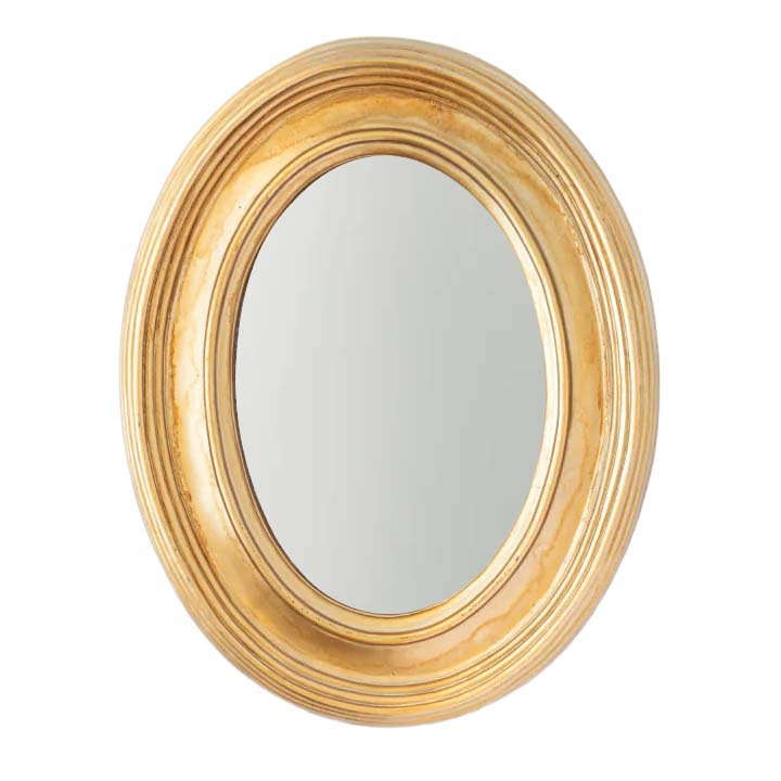 Gold-framed oval mirror on a white background