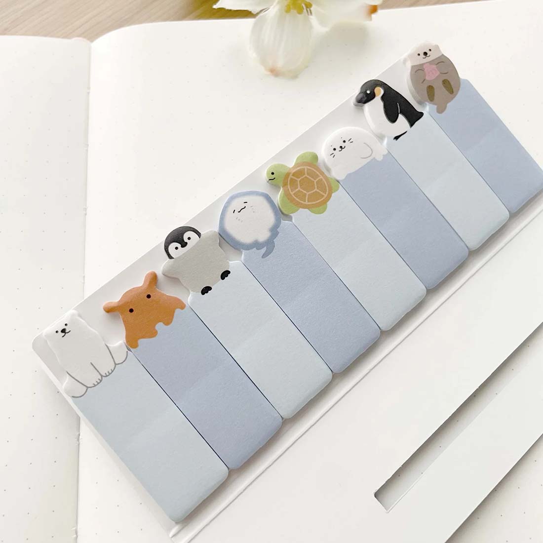 Stick marker packaging with cartoon animal illustrations on a blue background