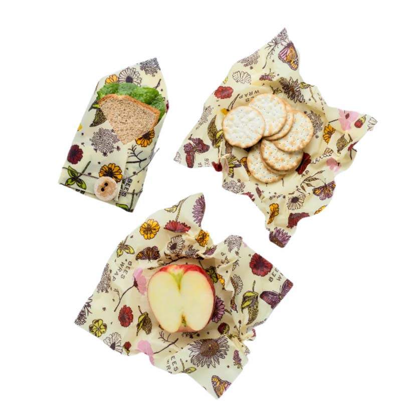 Two floral-patterned Bees Wrap sheets on a white background