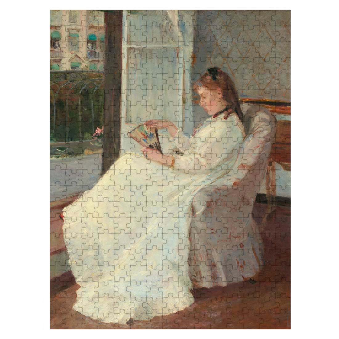 Puzzle box featuring an artwork of a woman in a white dress sitting by a window, with 'Manet & Morisot' branding.
