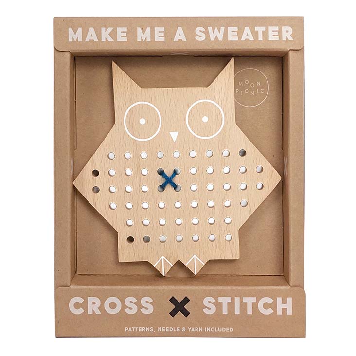 Wooden owl cross stitch kit with 'Make Me a Sweater' text on packaging