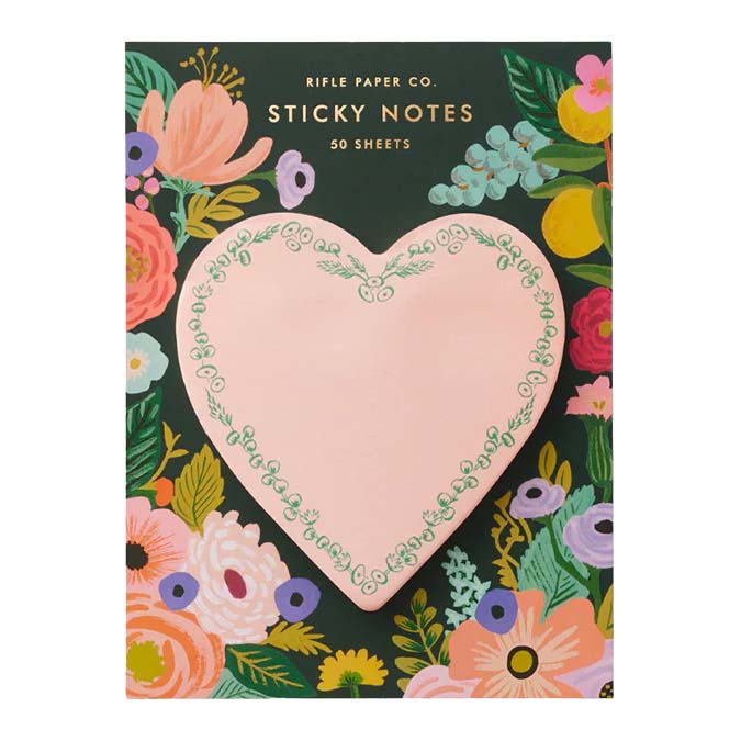 Heart-shaped sticky notes with floral design on a colorful background