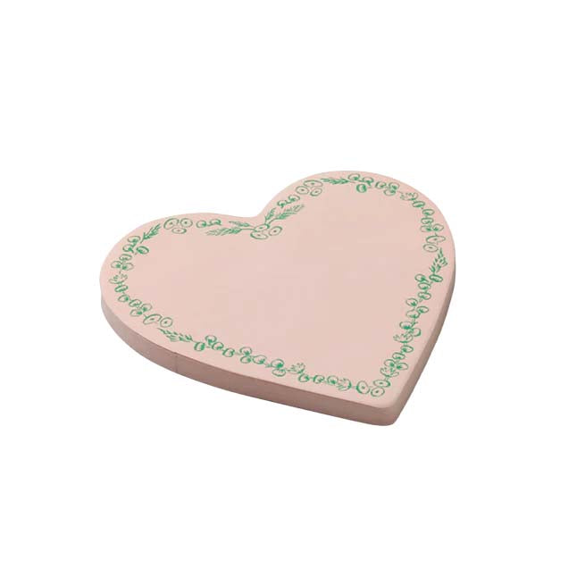 Heart-shaped sticky notes with floral design on a colorful background