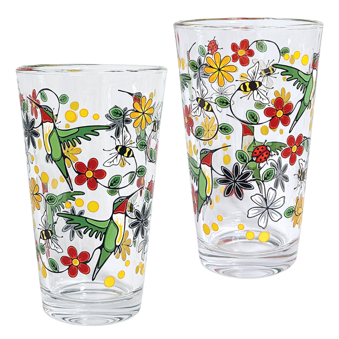 Two glass tumblers with colorful animal and floral designs on a white background