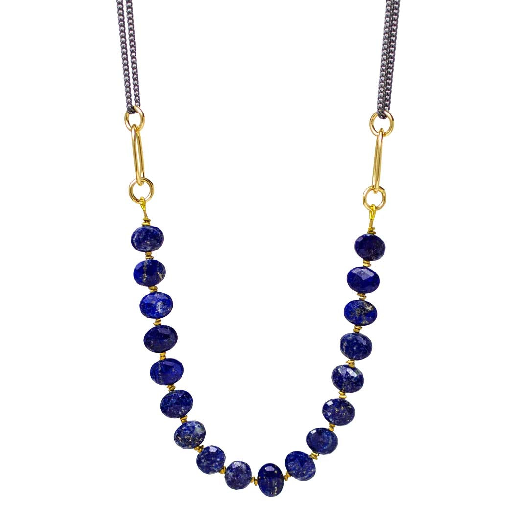 Necklace with blue beads and gold accents on a white background