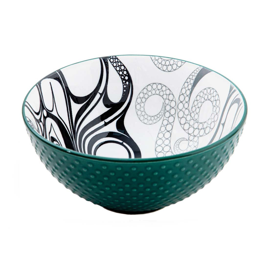 A medium-sized porcelain bowl with a green exterior and a black and white octopus pattern interior.