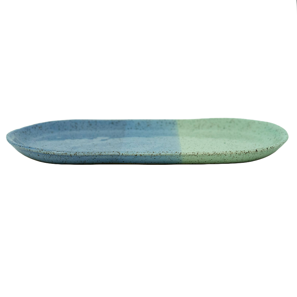 Ceramic blue and green oval shaped platter with speckled glaze