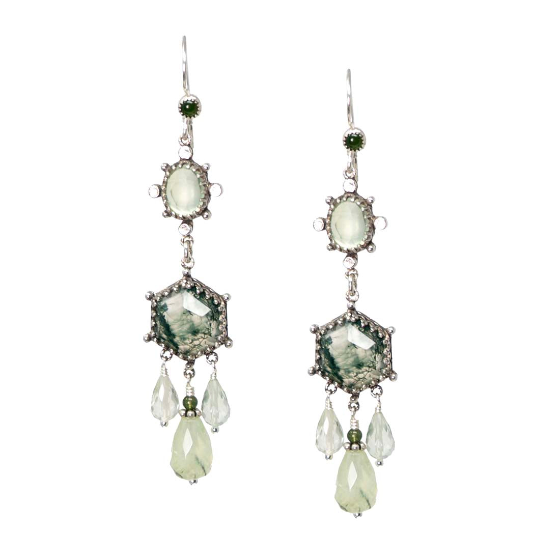 Pair of earrings with green and clear gemstones on a white background