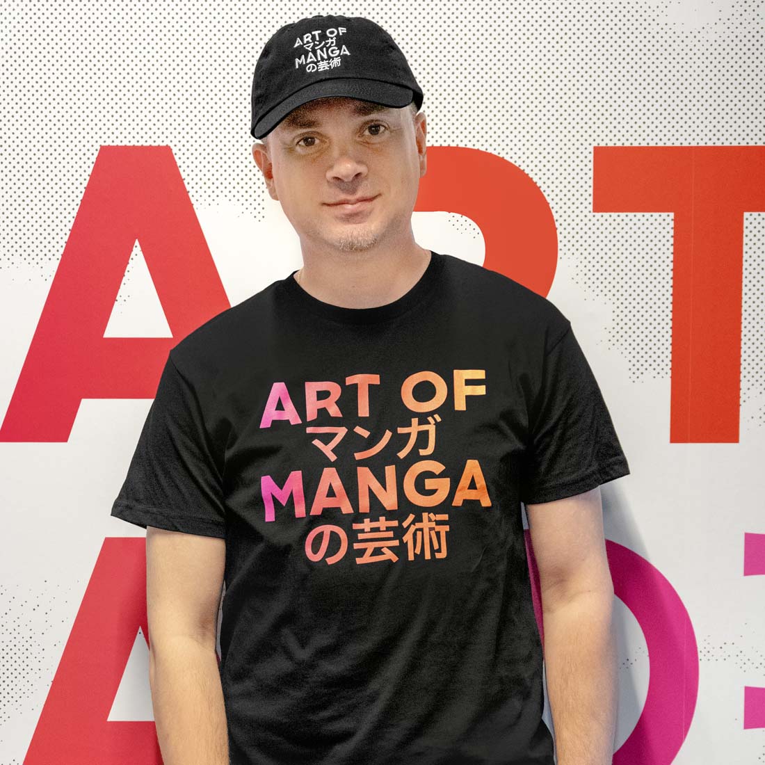 Black t-shirt with colorful 'Art of Manga' text on a white background