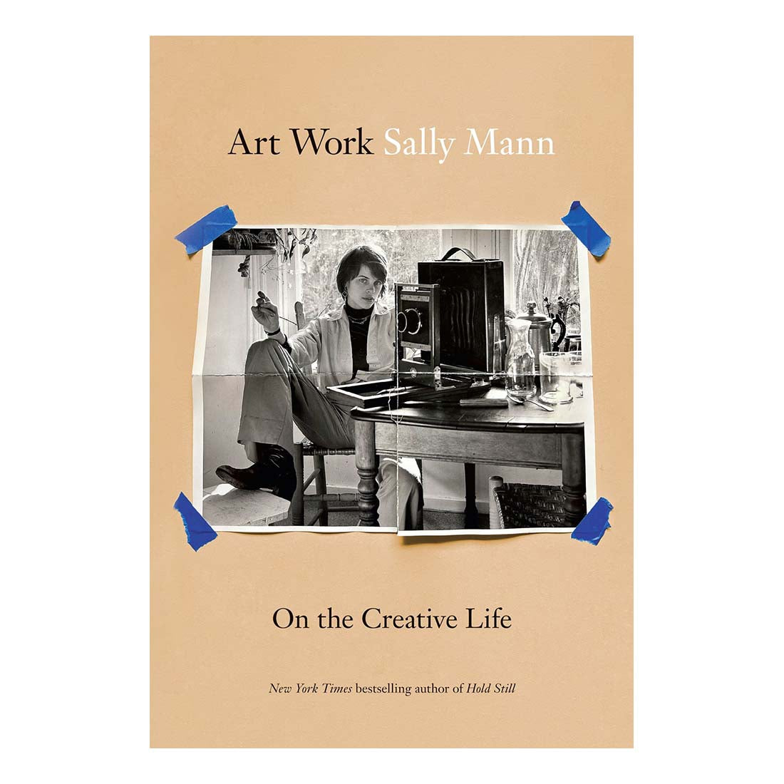 Book cover of 'Art Work Sally Mann: On the Creative Life' with a photo of a woman at a desk.