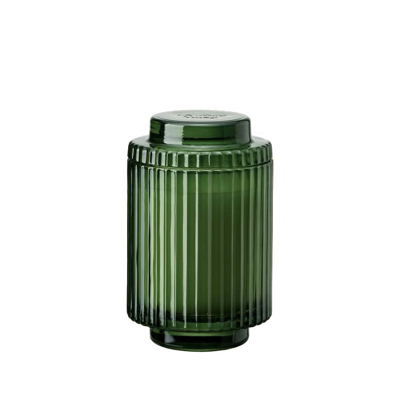 A green ribbed glass candle jar without a lid, designed for use with a candle.