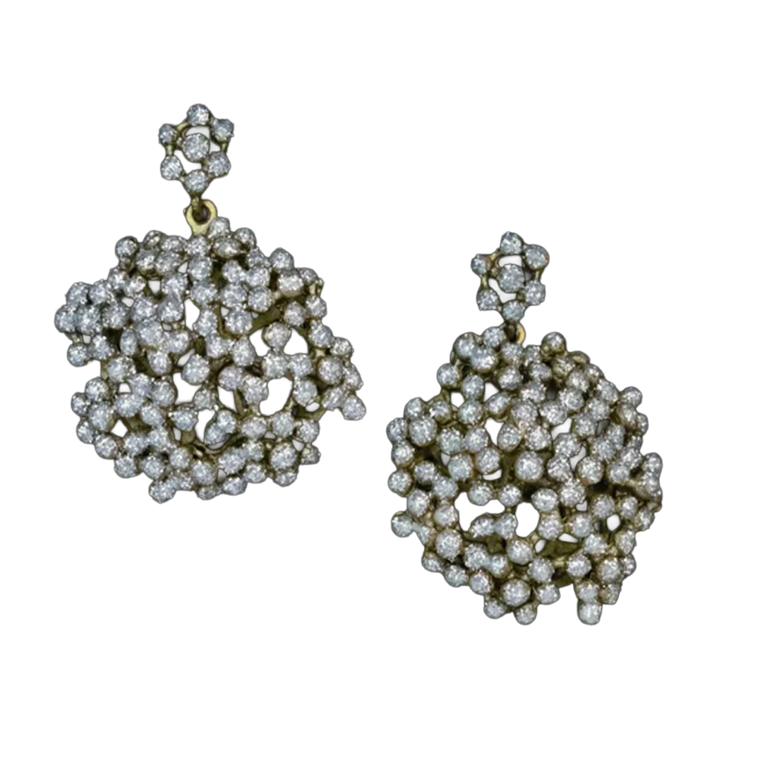 Pair of diamond earrings on a white background