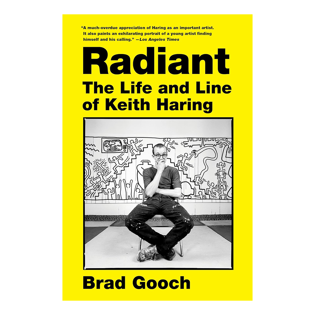 Book cover of 'Radiant: The Life and Line of Keith Haring' by Brad Gooch with a yellow background and black and white photo of Keith Haring.