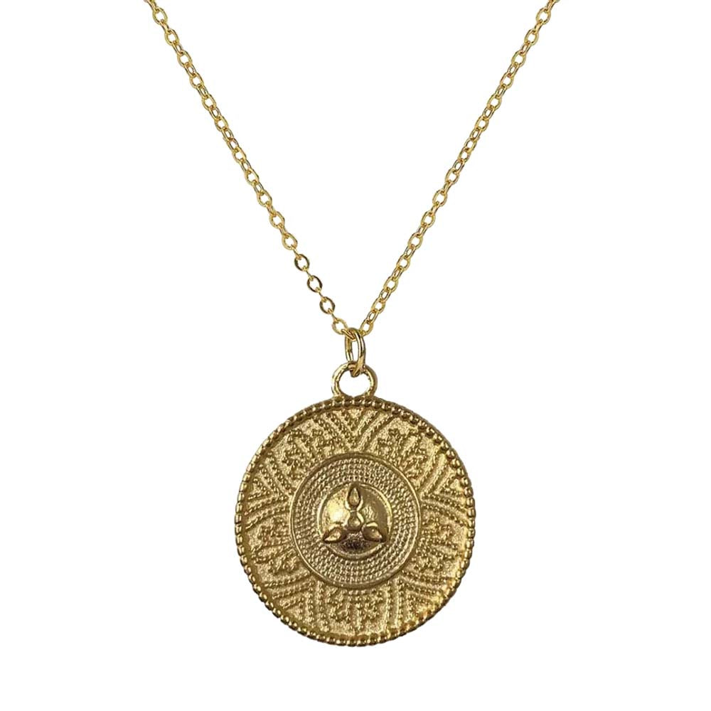 Gold necklace with a circular pendant on a white background