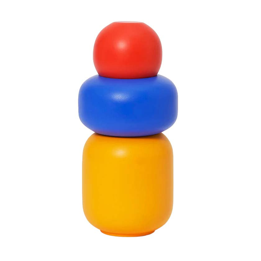Stack of colorful cylindrical objects on a white background