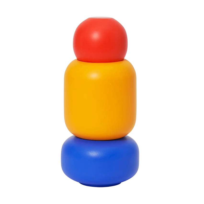 Stack of colorful cylindrical objects on a white background