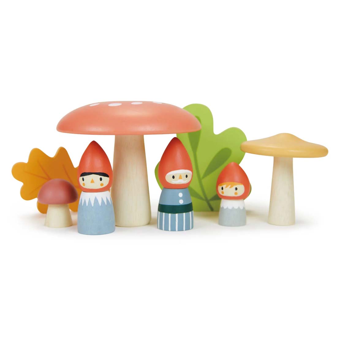 Wooden gnome figurines with colorful mushrooms and leaves on a white background