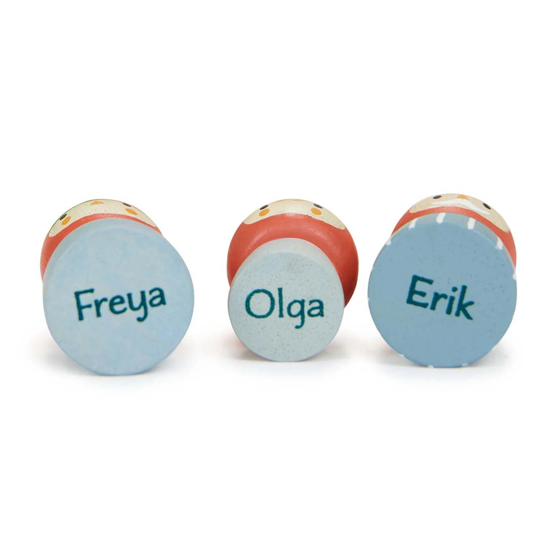 Wooden gnome figurines with colorful mushrooms and leaves on a white background