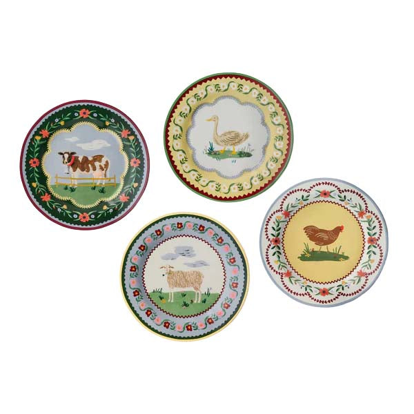 Set of four decorative plates with farm animal illustrations on a white background