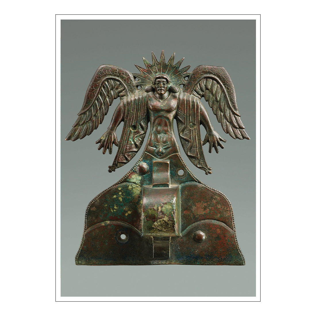 Bronze artifact with an eagle-headed figure on a gray background