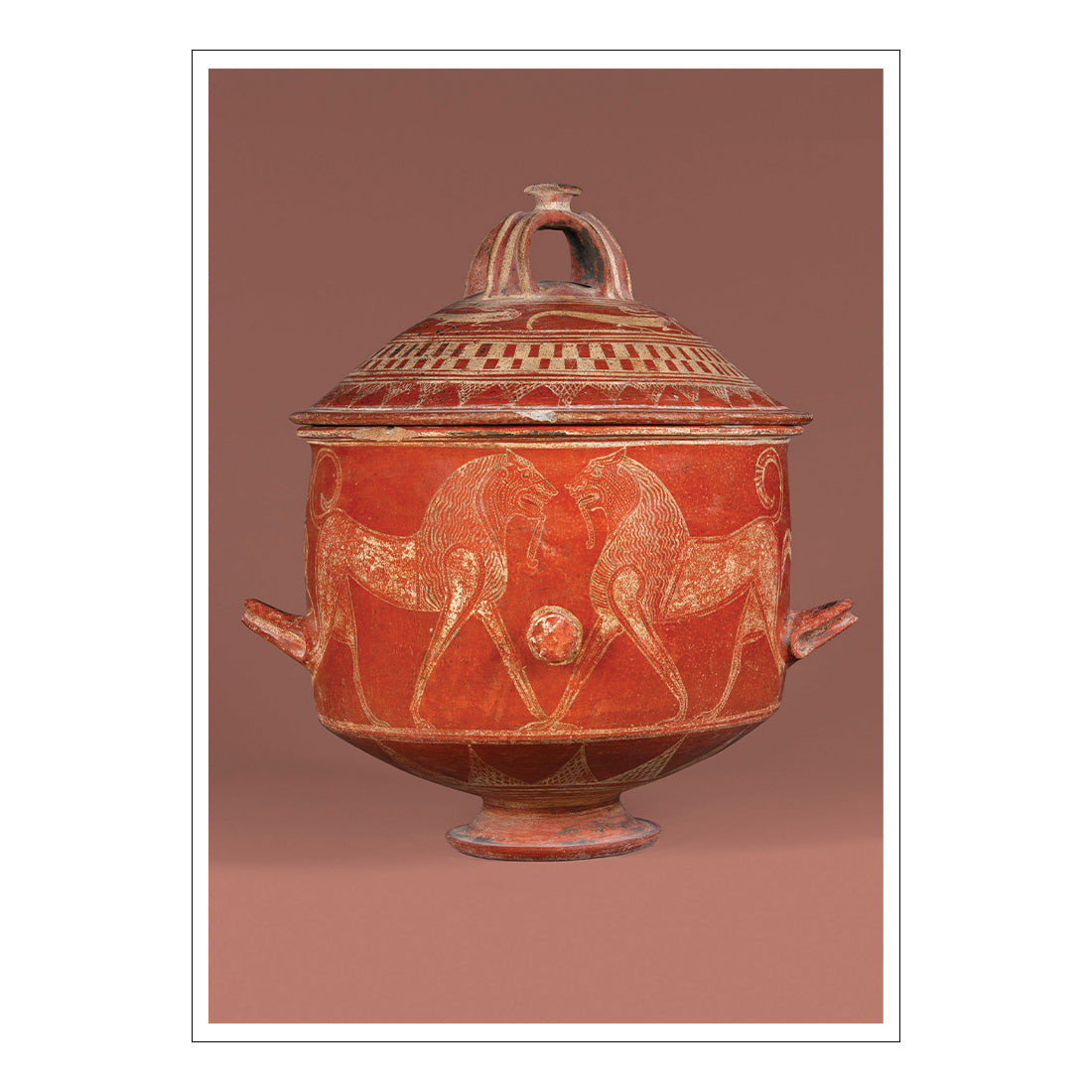Red ceramic jar with white animal designs on a brown background