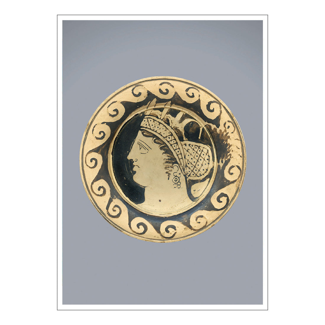Gold coin with a profile of a woman's face on a gray background