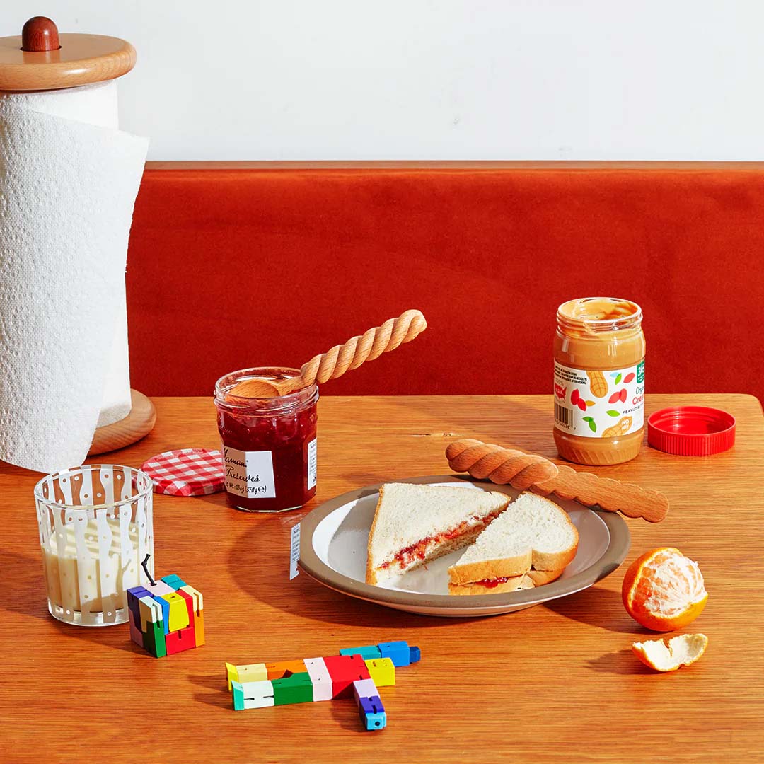 A wooden knife and spoon with a twisted design.