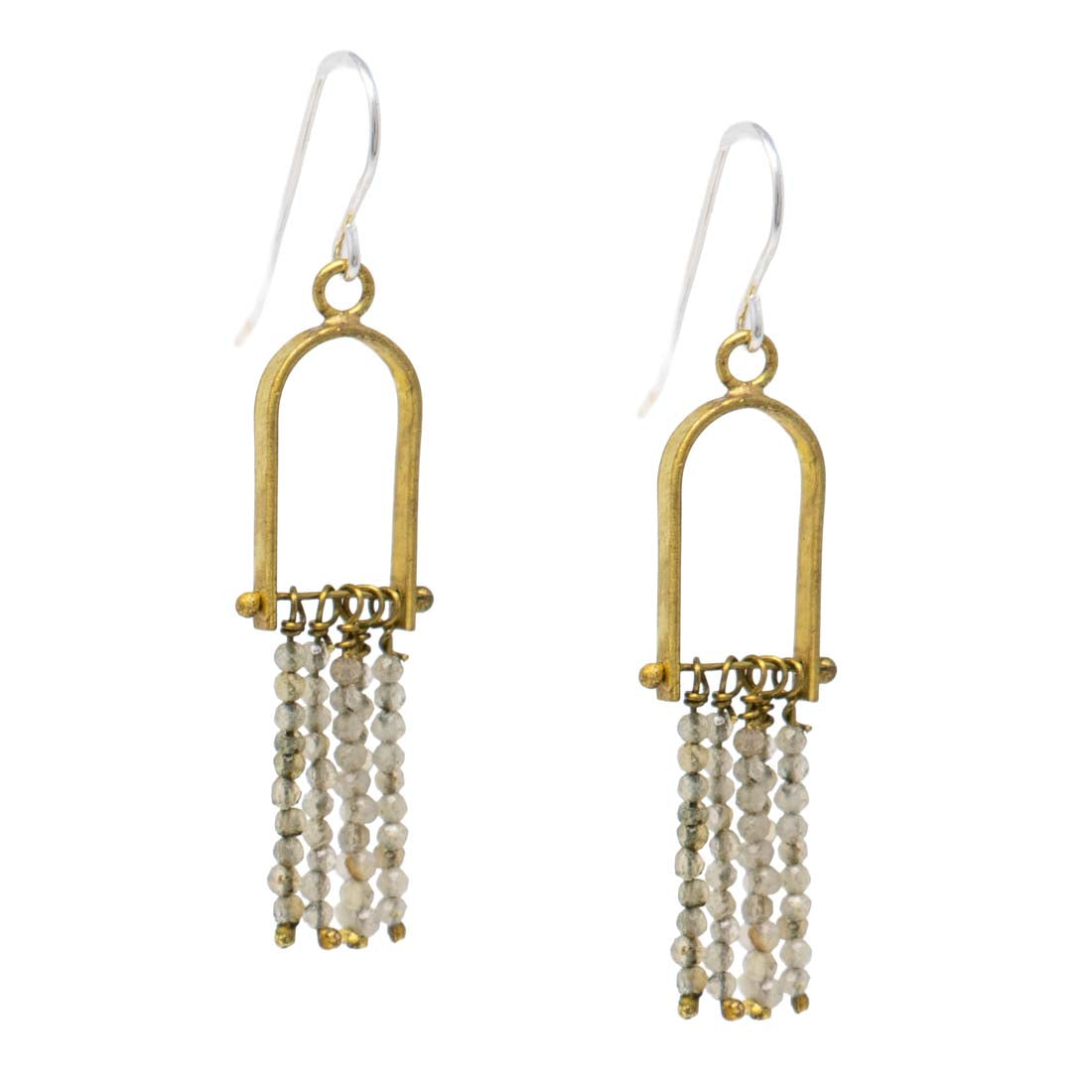 Gold and pearl drop earrings on a white background