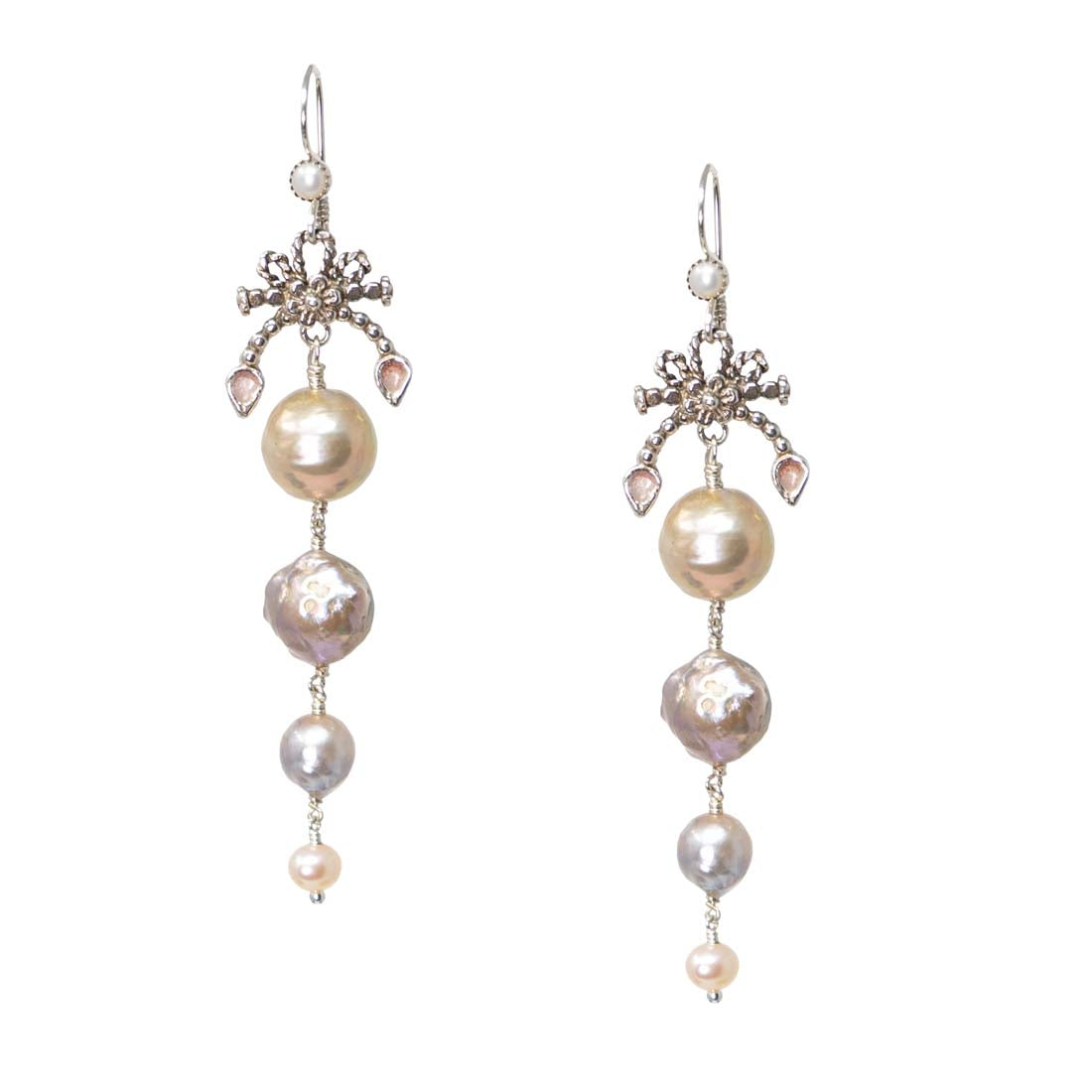 Pair of pearl earrings with silver accents on a white background