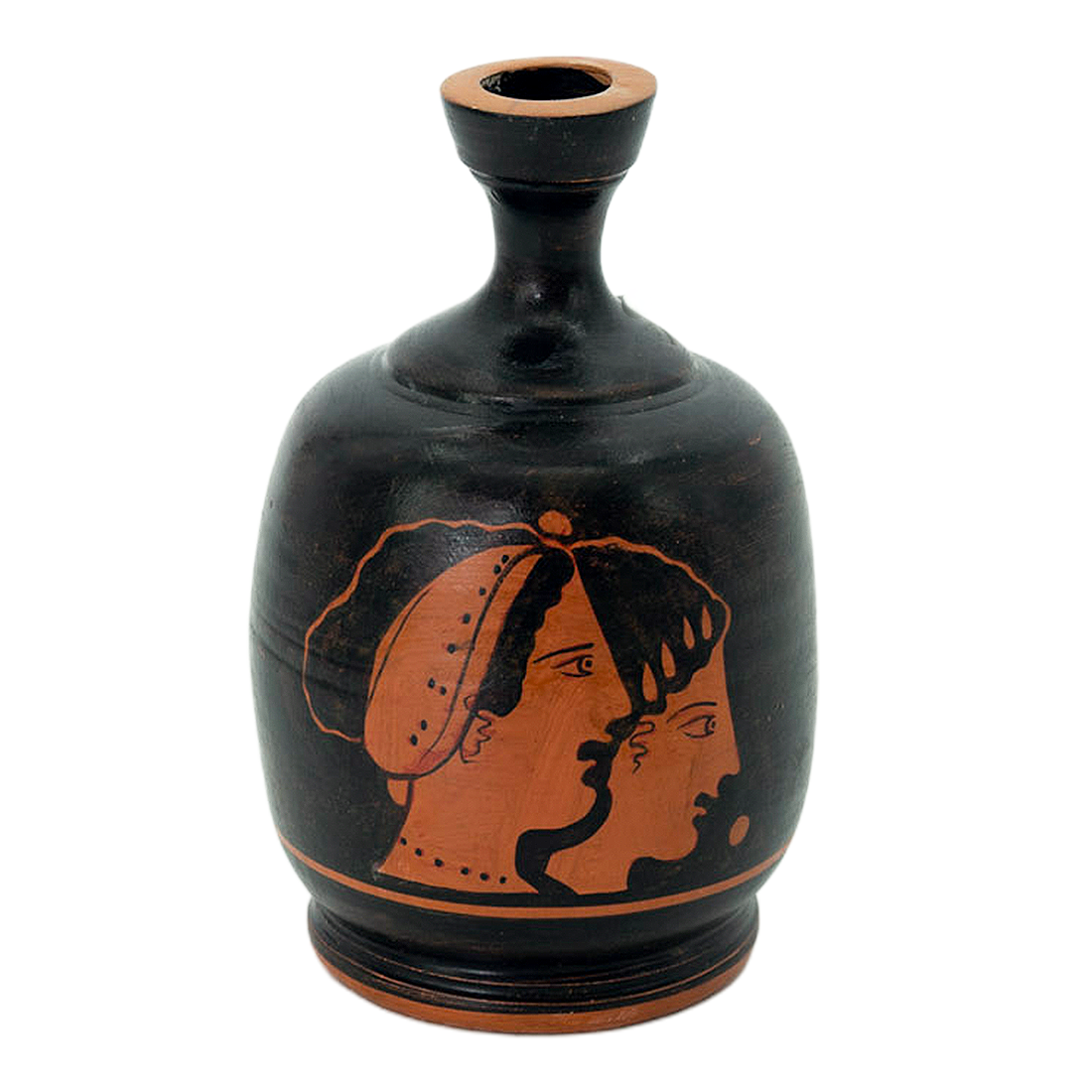 Black vase with red face design on a white background