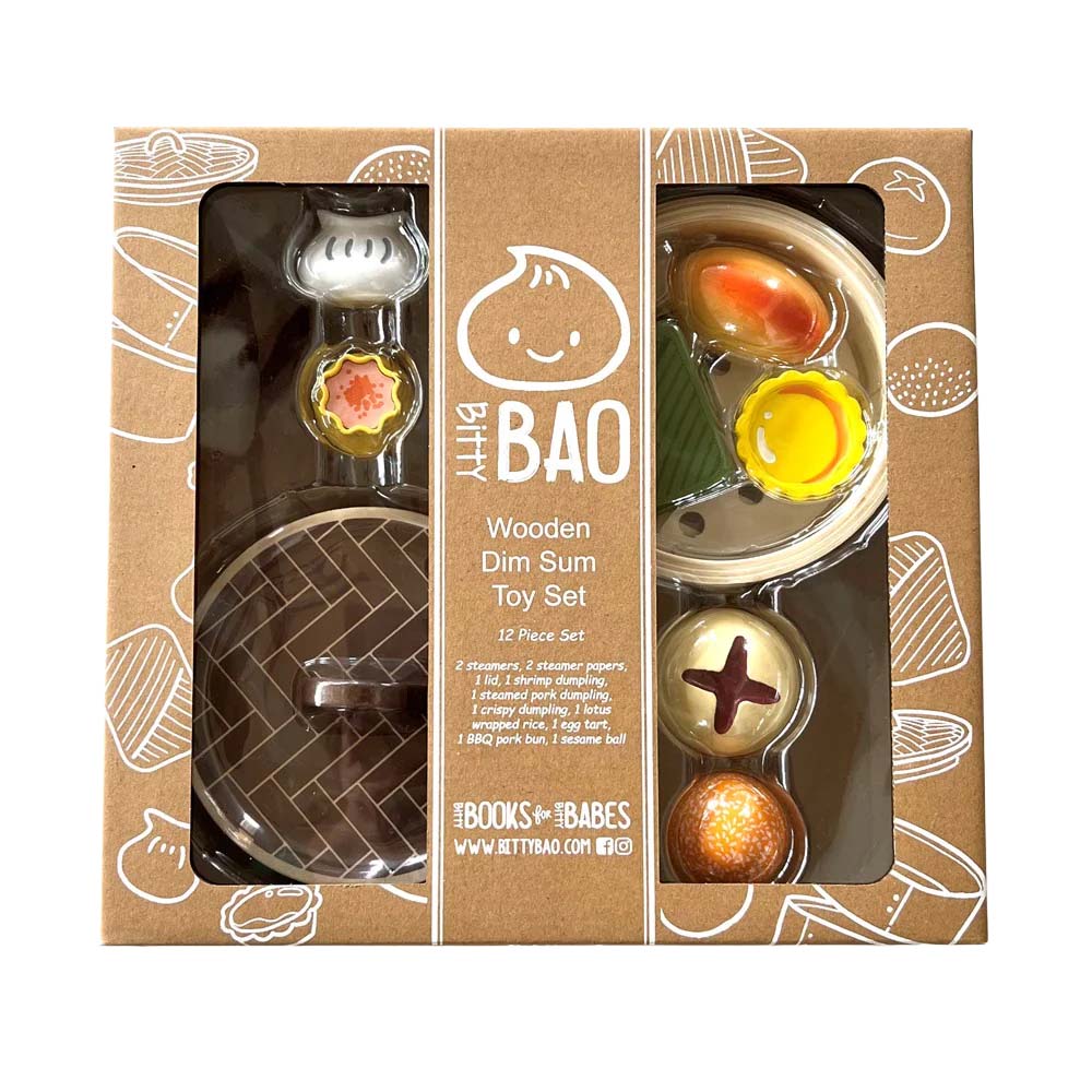 Toy set resembling a steamer basket with various food items on a white background