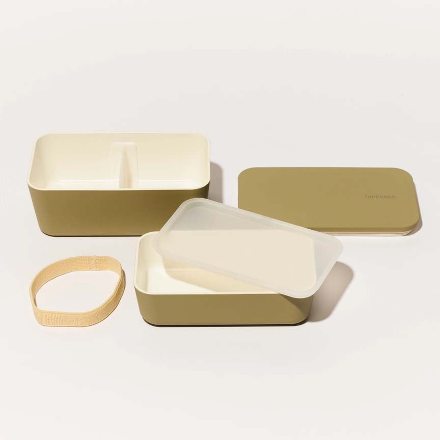 Green lunch box with 'TAKENAKA' branding on a white background