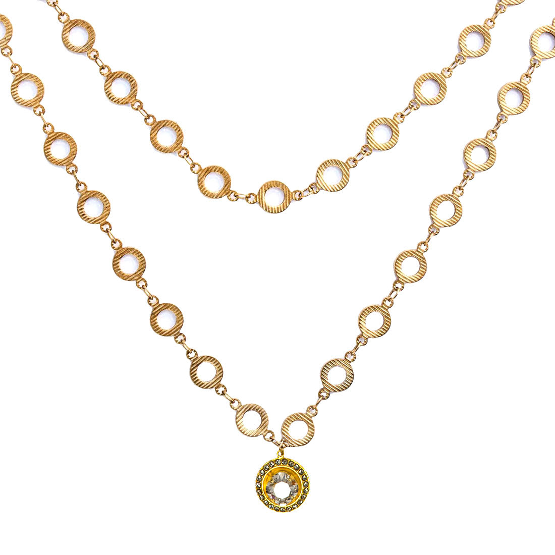 A gold-colored double-layered necklace with crystal drops and circular ornamental designs.