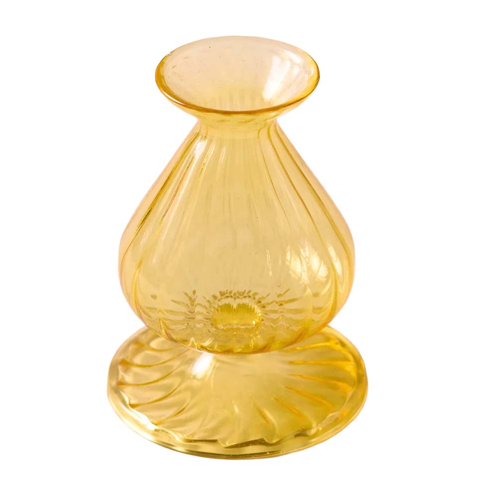 Yellow glass vase with a textured design on a white background