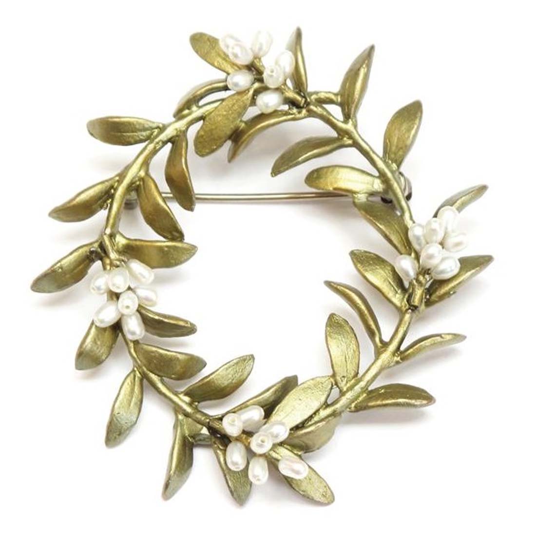 Gold wreath brooch with leaves and small white flowers on a white background