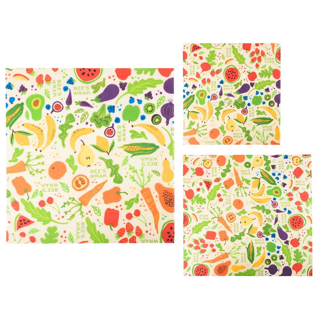 Set of three patterned paper bags with colorful fruit and vegetable designs on a white background.