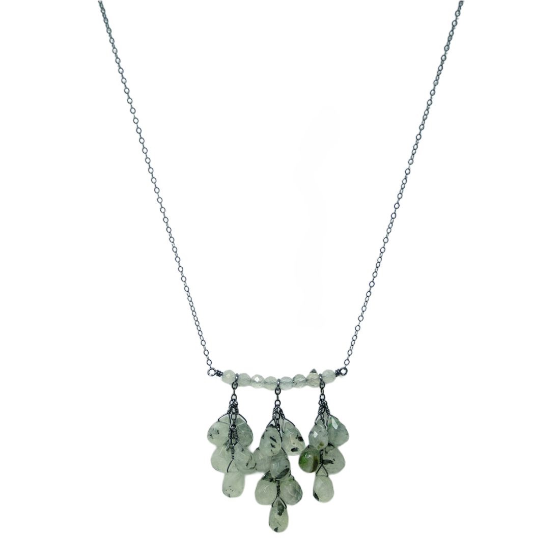 Necklace with green teardrop-shaped beads on a white background