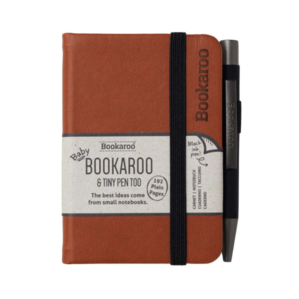 Brown notebook with black pen on a white background