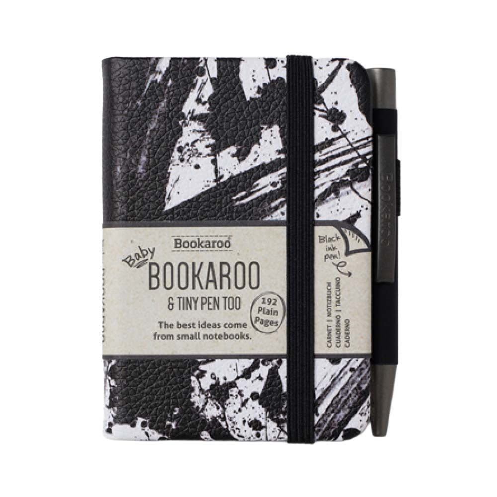 Black and white notebook with pen on a white background