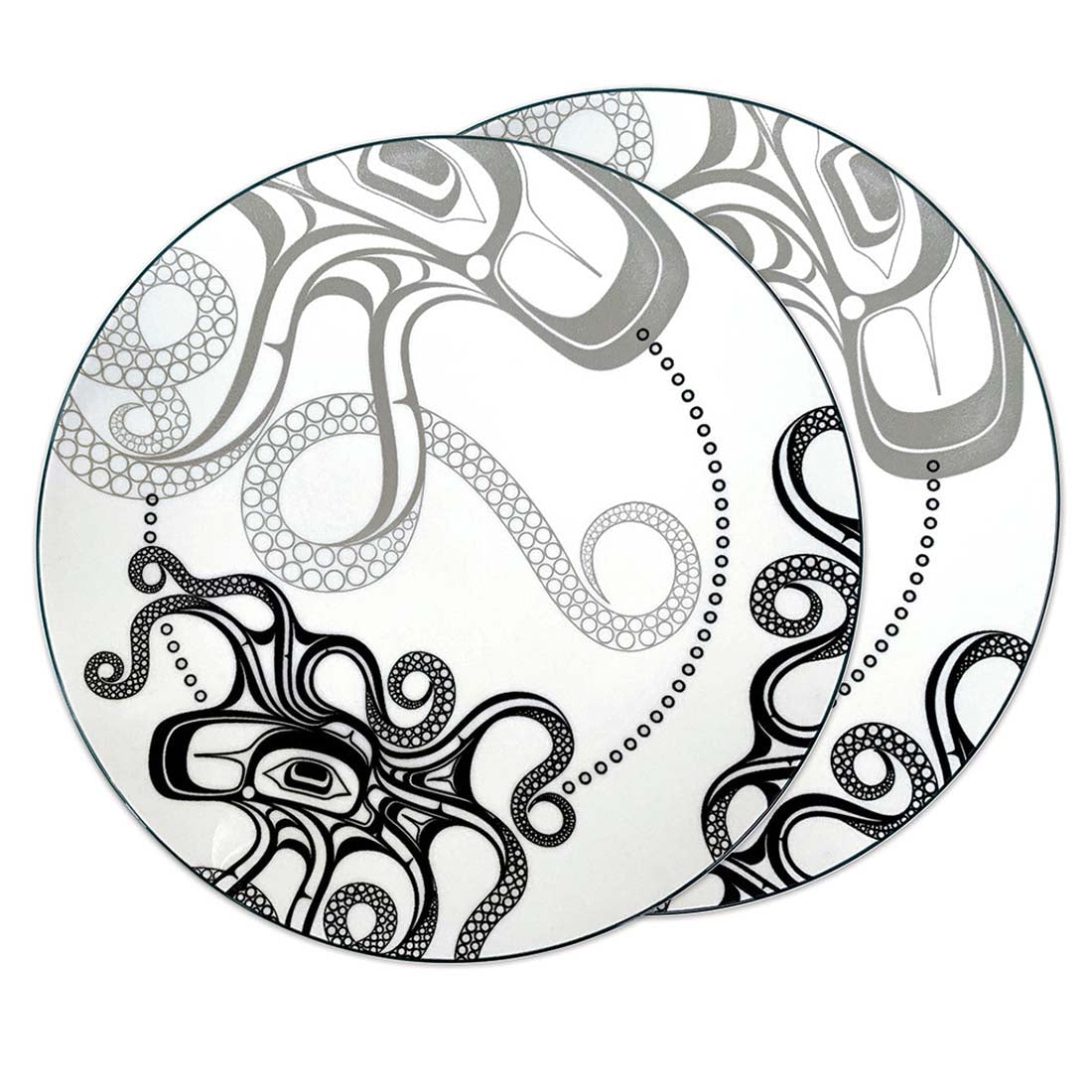 A set of two round porcelain dinner plates with a contemporary Indigenous design featuring an octopus motif.